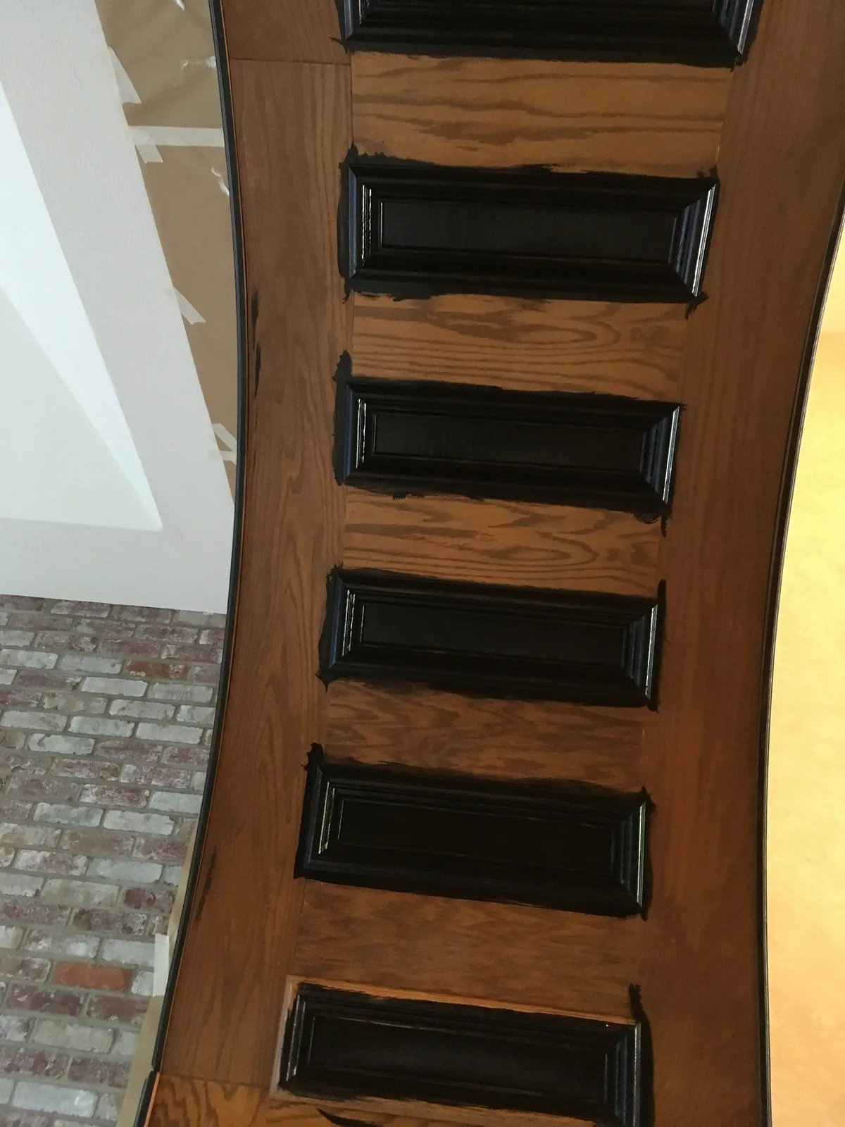 Arched oak trim being gel-stained