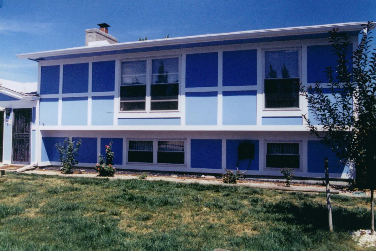 Bi-level home repainted in two blues — after