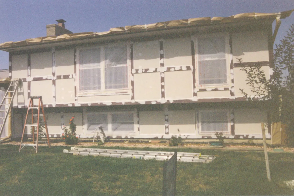 Bi-level home repainted in two blues — before