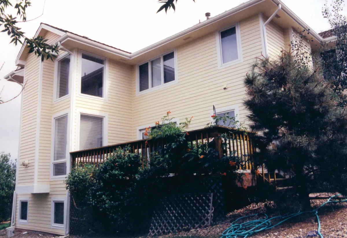 Three-story home among pines — after