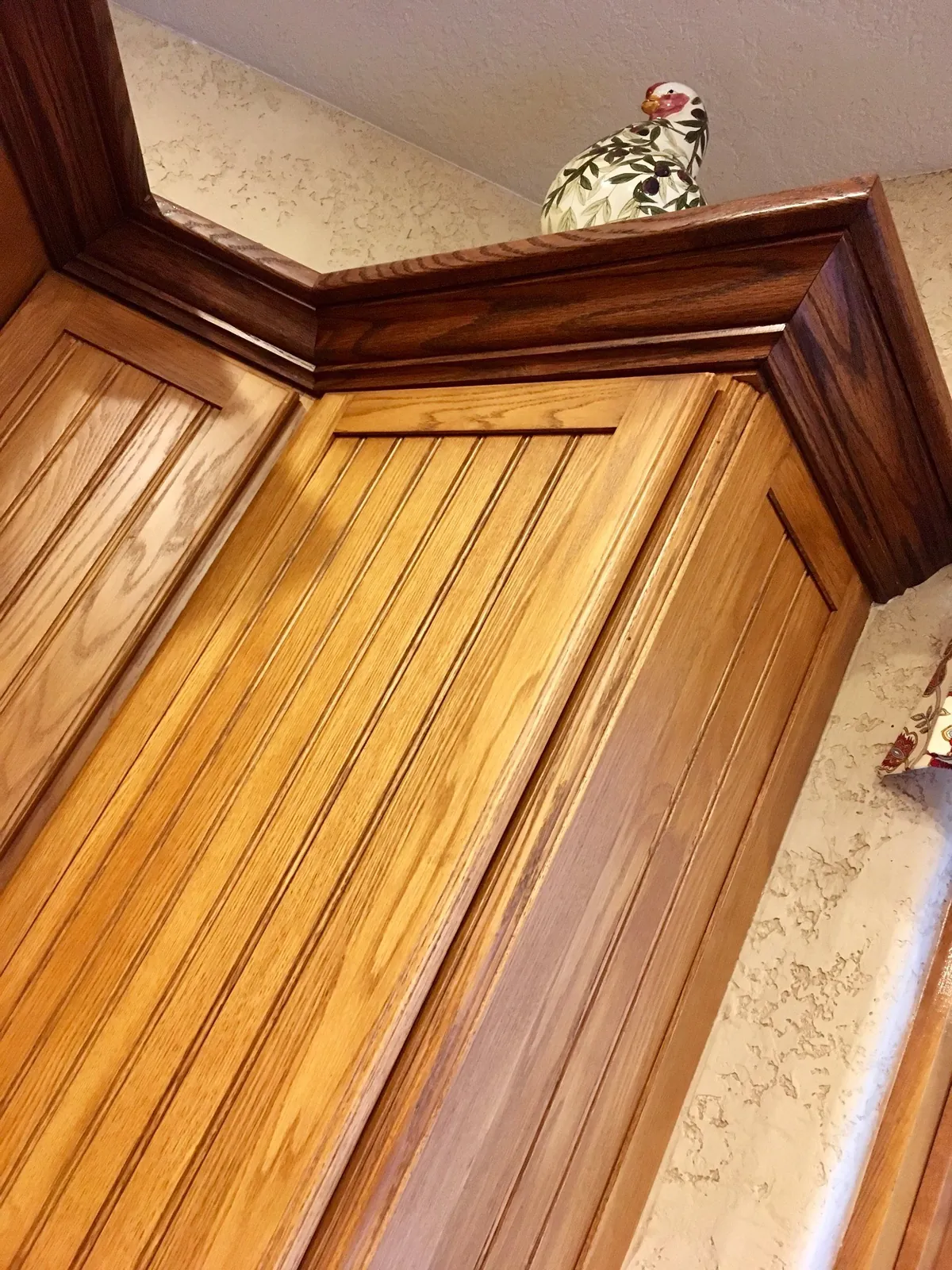 Refinished cabinet crown and stile detail