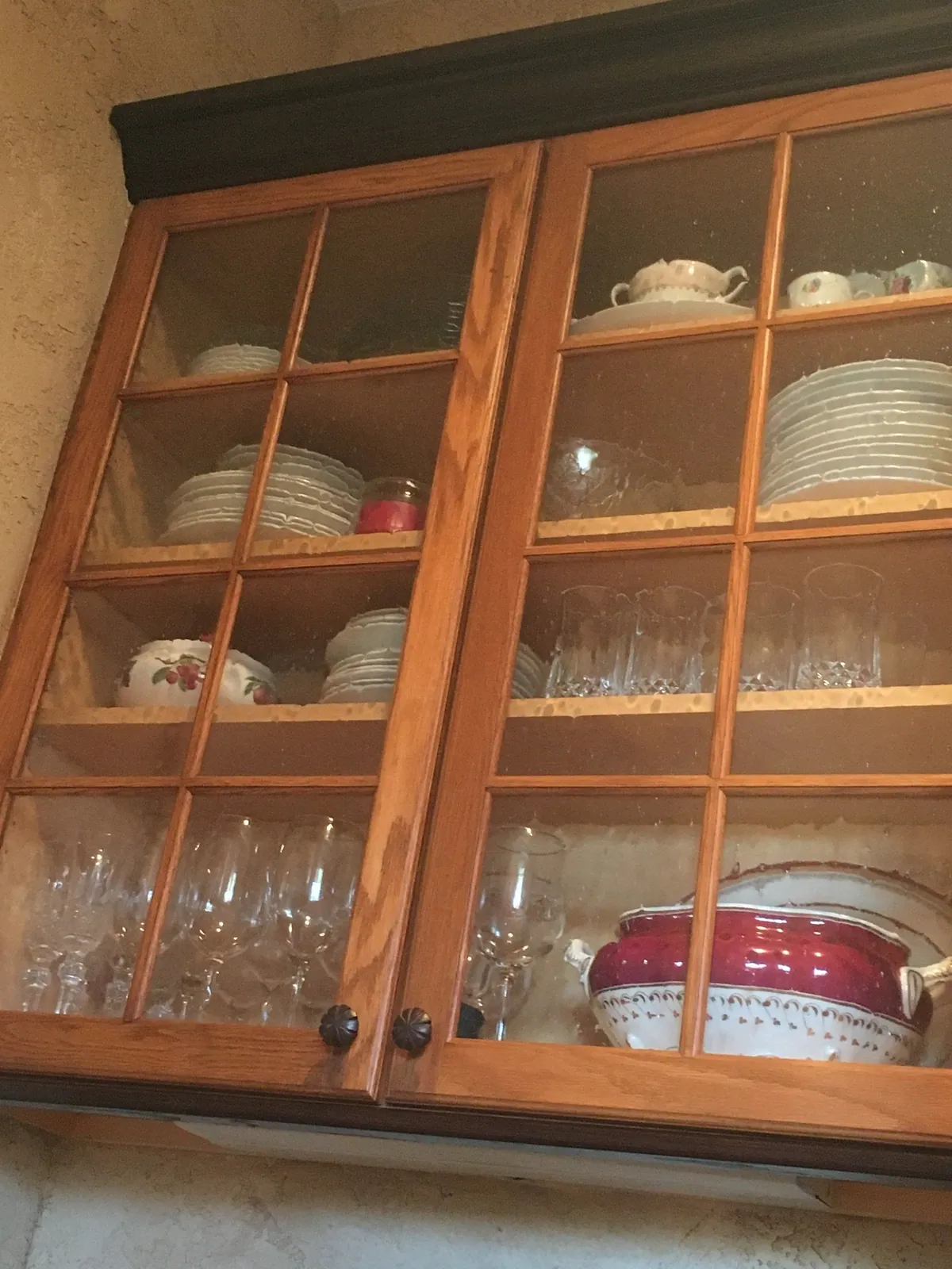 Glass-front hutch with restored finish
