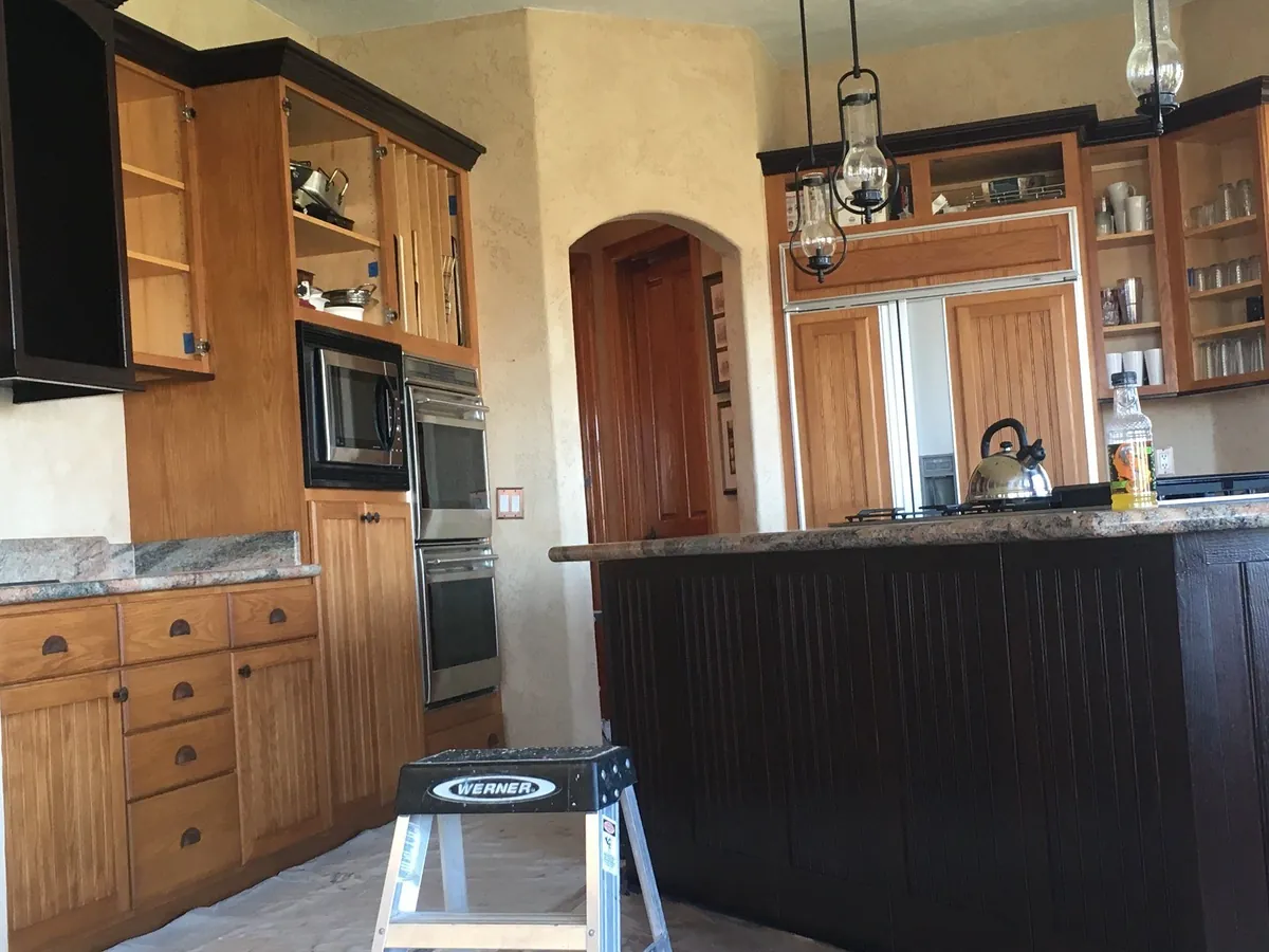 Kitchen island refinished in espresso, perimeter in progress