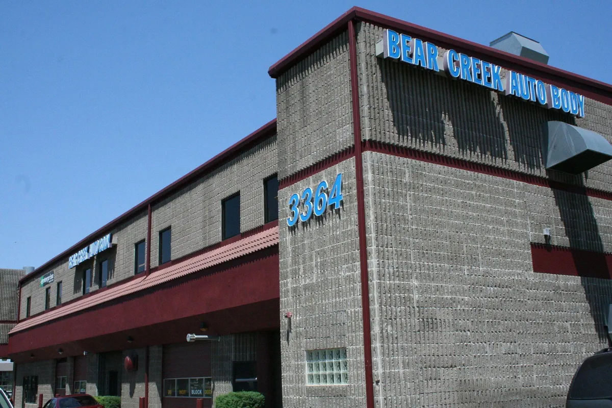 Commercial building exterior repainted in red and grey