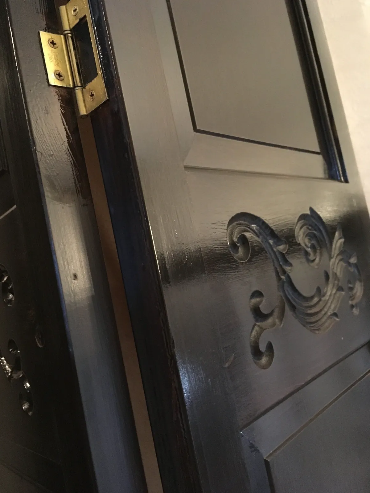 Six-panel door finished in satin black