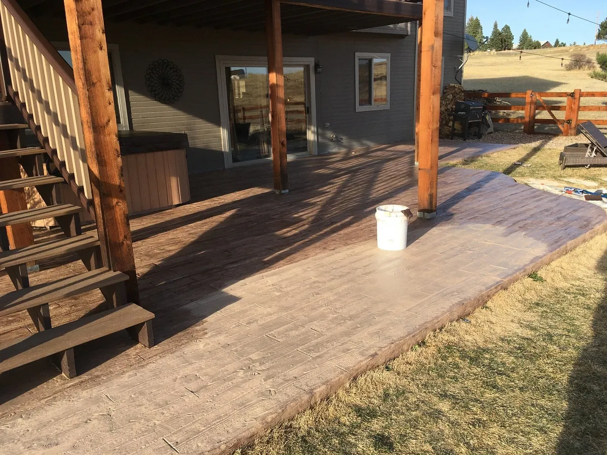 Concrete patio finished to look like weathered wood planks
