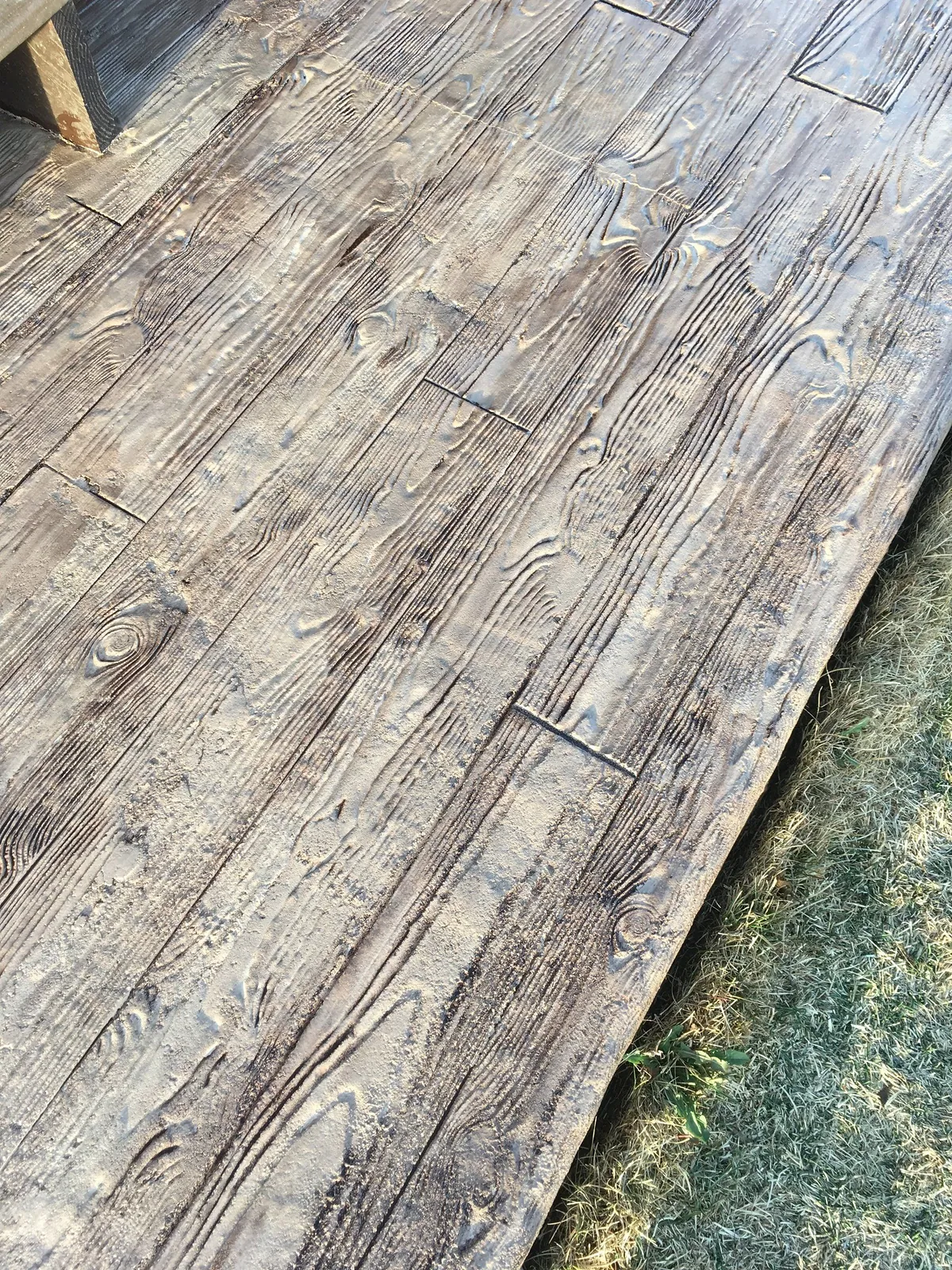 Close detail of faux wood-plank concrete