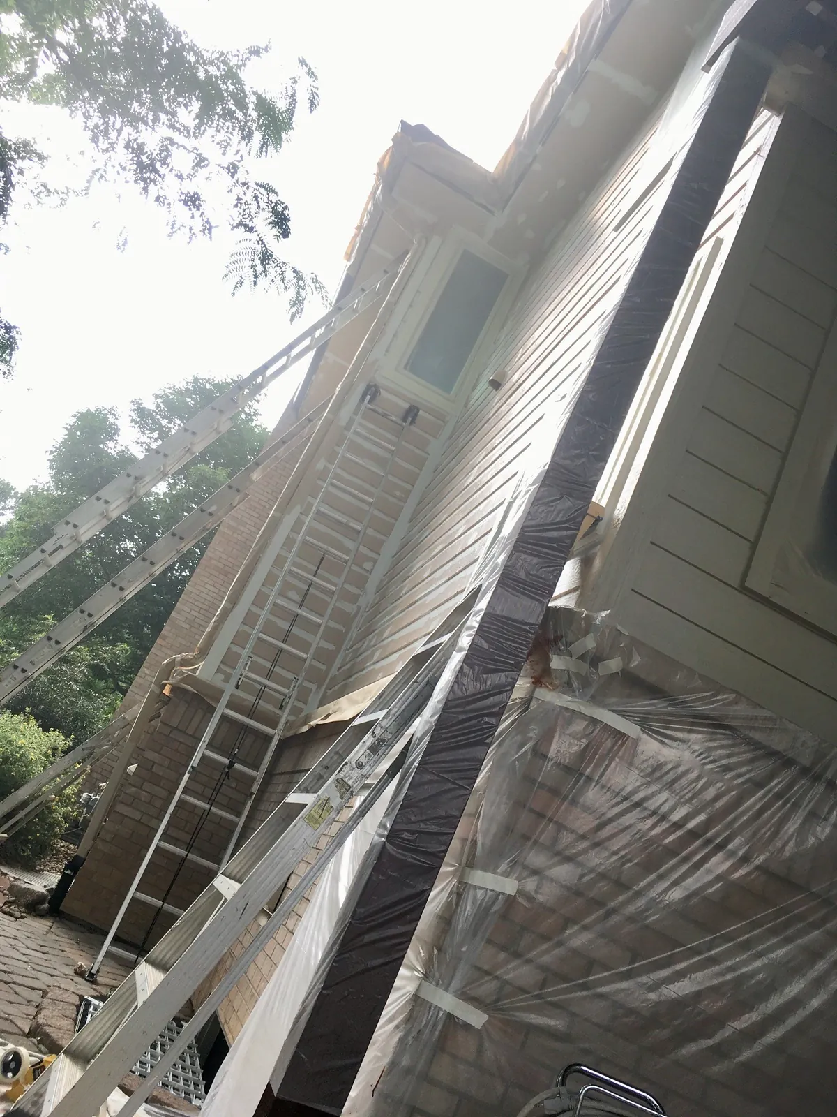 Windows masked with clean, tight lines before spraying