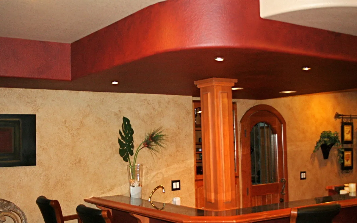 Red soffit and glazed walls over a home bar