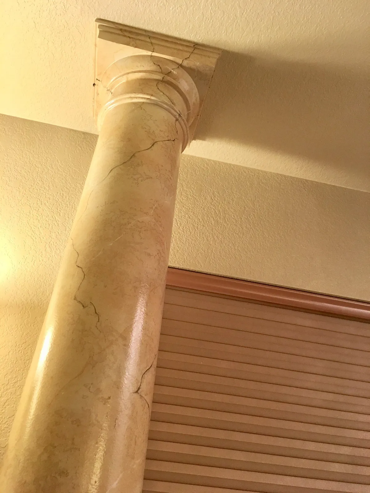Column finished in faux marble with fine veining