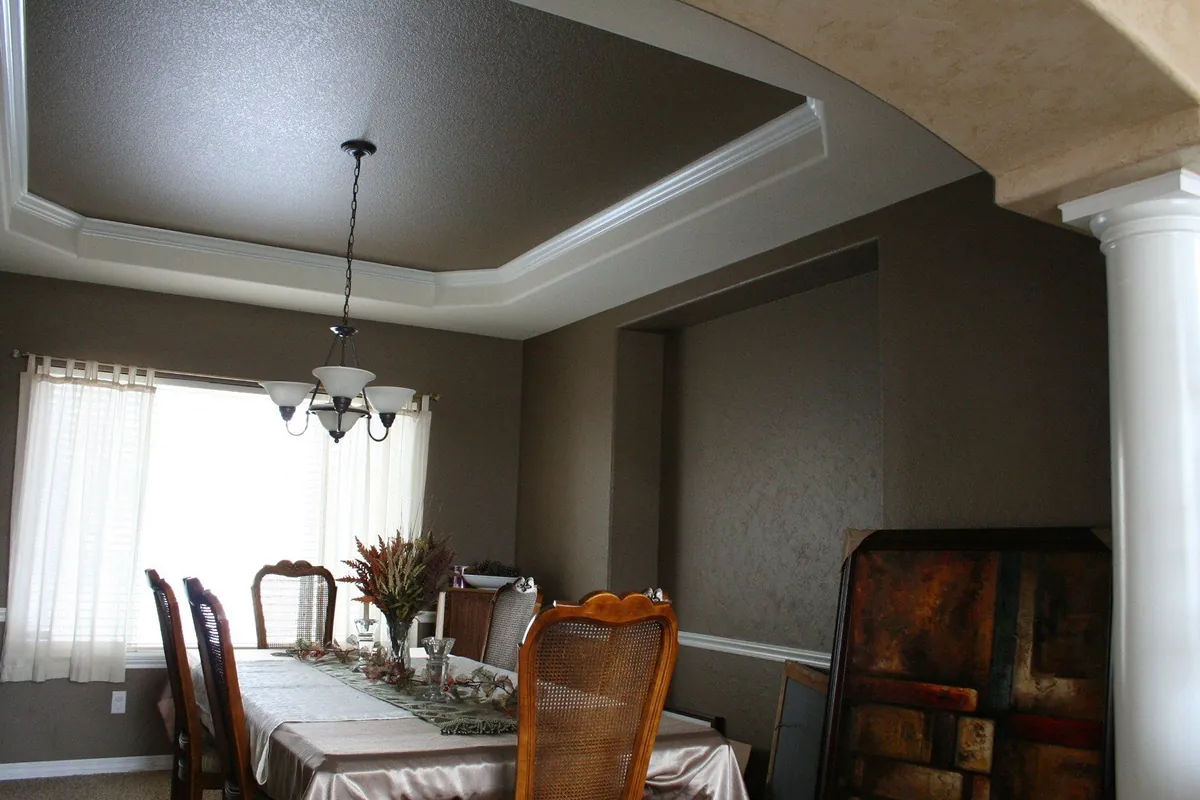 Dining room in a warm stone glaze with tray ceiling