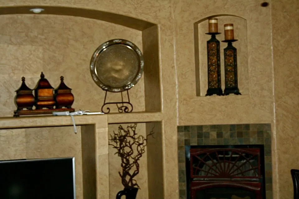 Glazed display niches over a fireplace