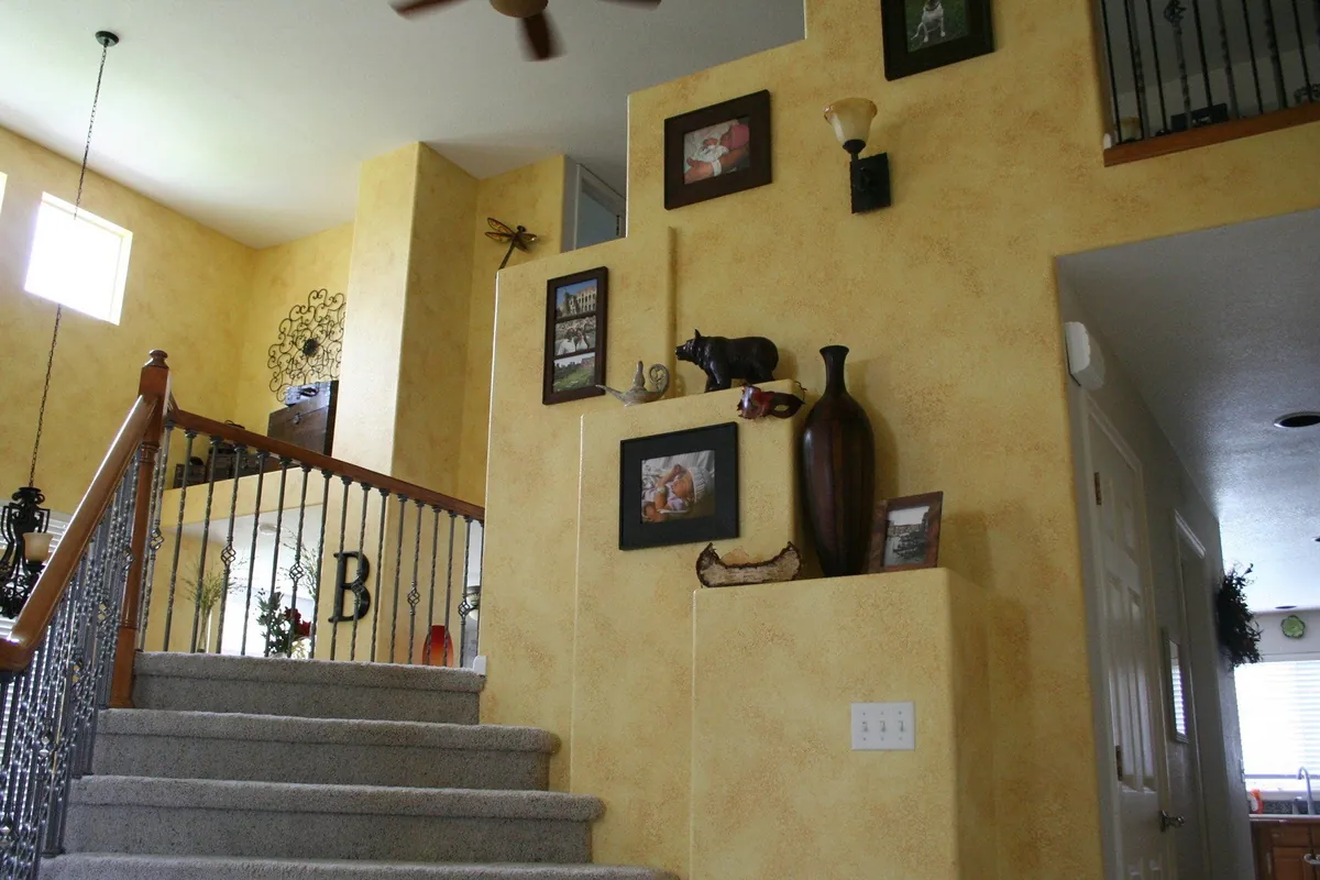 Golden glazed stairwell gallery wall