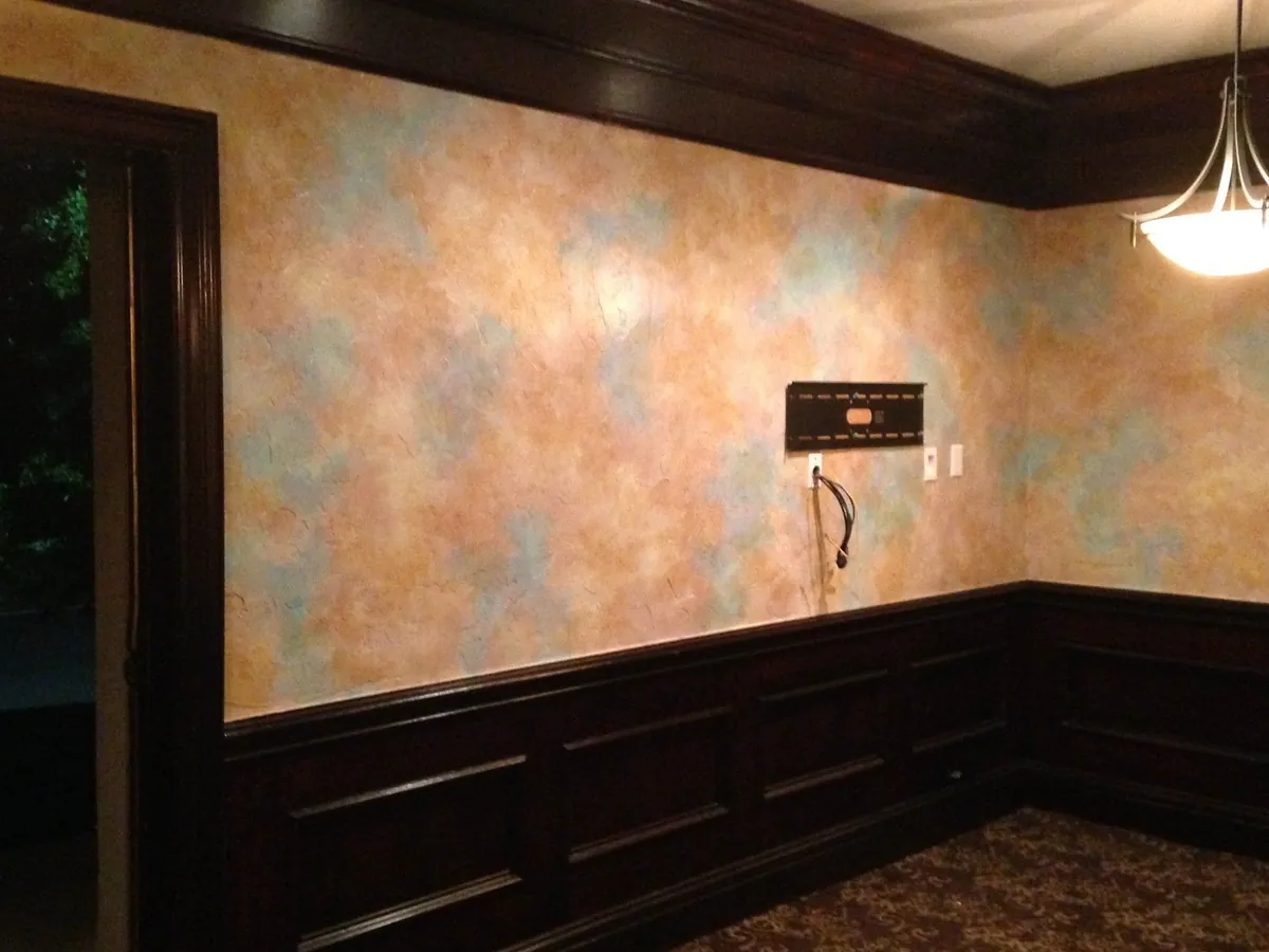 Multicolor glazed walls above dark wainscoting