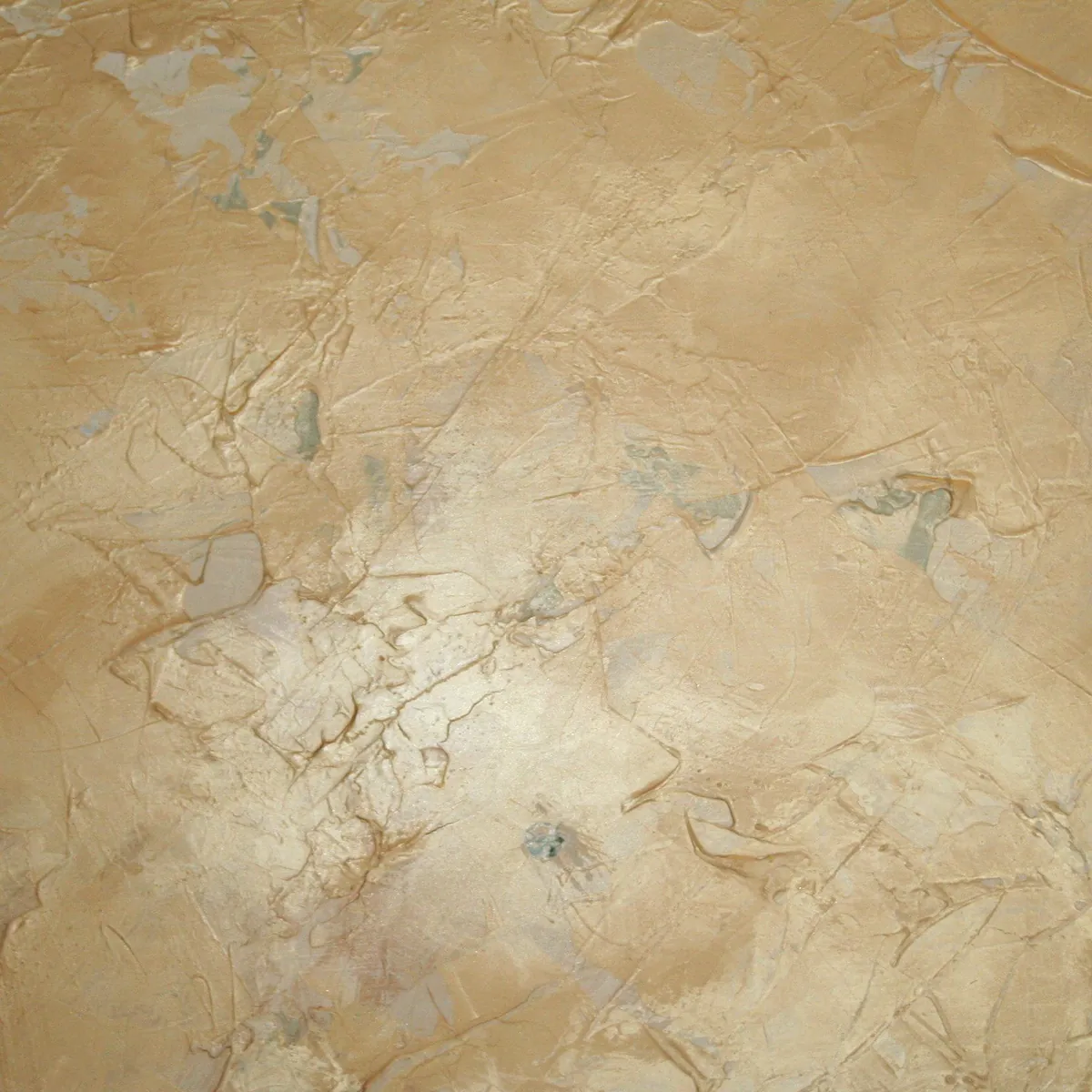 Metallic plaster accent wall in layered ivy, silver and gold