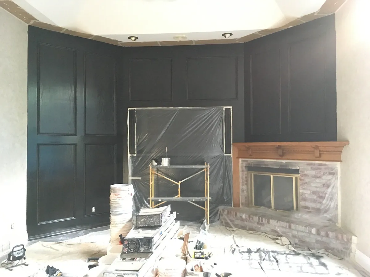 Living room paneling refinished in black