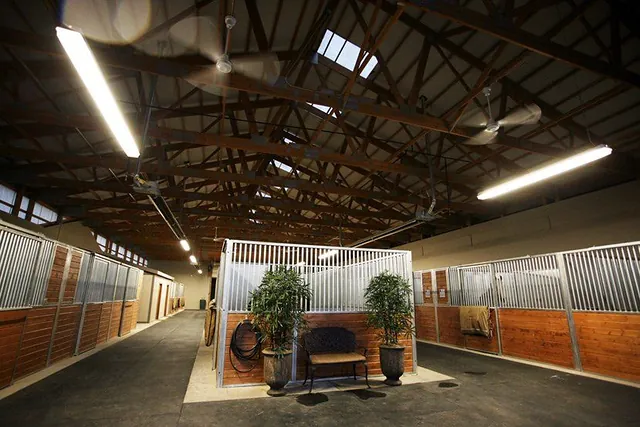 Interior of a horse barn with refinished stalls