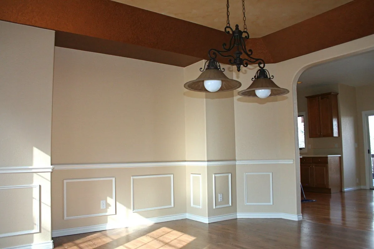 Open dining room with painted wainscoting