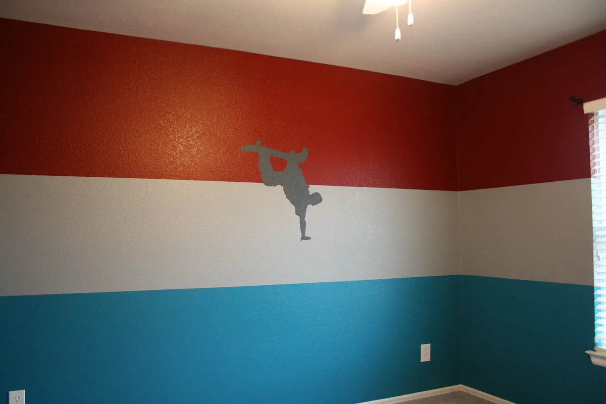 Striped kids room with a skateboarder silhouette